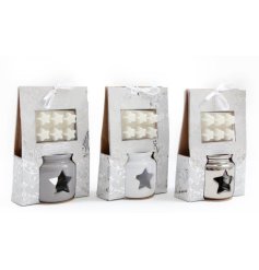 3 assorted oil burners with a star cut out decal in a mistletoe fragrance