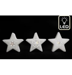 An assortment of 3 light up LED star decorations