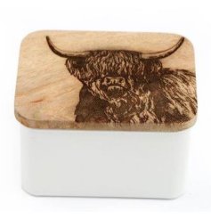 A unique white storage tin with a natural wooden lid. Beautifully crafted with a laser cut highland cow design.
