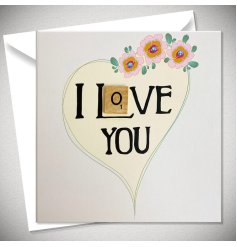 Show someone you care with this unique scrabble card with a pretty heart and floral illustration