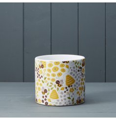 A fine quality planter with a colourful and cute bee, hive and floral design. 