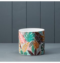 A bright and cheerful planter featuring a colourful and striking jungle foliage pattern.