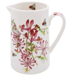 A colourful jug from the Bee - Tanical range, displaying a cluster of honeysuckle and bees. 