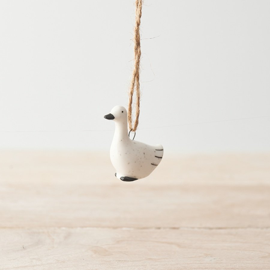 cute hanging duck decoration with a painted black nose attached by jute twine