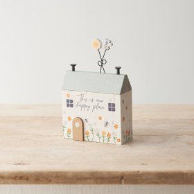 A sweet wooden house decoration with "this is our happy place" message and pretty bee/ floral details. 