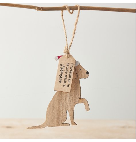 A laser cut wooden Labrador decoration with a red painted Santa's hat and wooden slogan tag. 