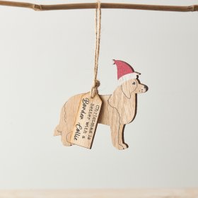 A decoration with Border Collie silhouette, "Christmas is better with a Border Collie" tag and Santa hat.