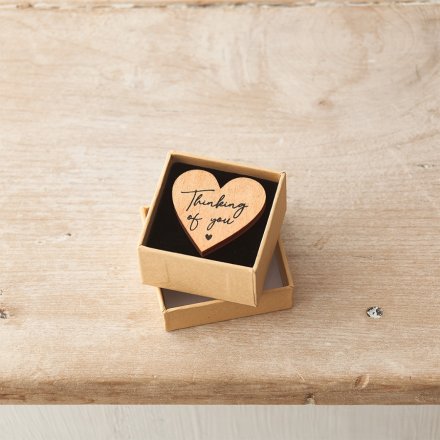 A rustic wooden heart shaped token with a beautifully scripted 'thinking of you' slogan. 