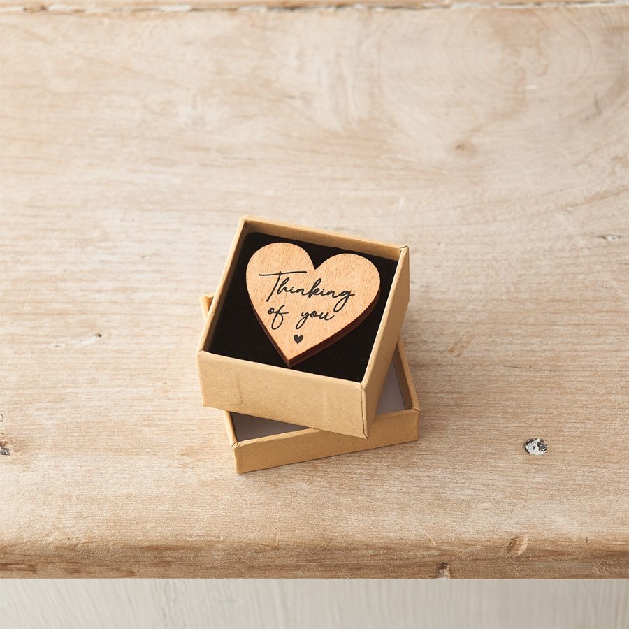 A small pocket sized wooden token with a beautifully scripted 'thinking of you' slogan. 
