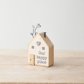 A sweet wooden house block with "our happy place" text and pretty heart and flower details. 