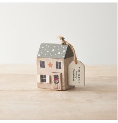 A beautifully painted and crafted miniature wooden house with seasonal gift tag. 