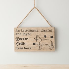 A wooden sign with rope hanger and Border Collie inspired illustration and text, with paw print details. 