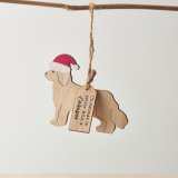 A Cockapoo shaped hanging decoration with "Christmas is better with a Cockapoo" tag and red Santa hat detail. 