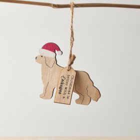A Cockapoo shaped hanging decoration with red Santa hat and "Christmas is better with a Cockapoo" text.