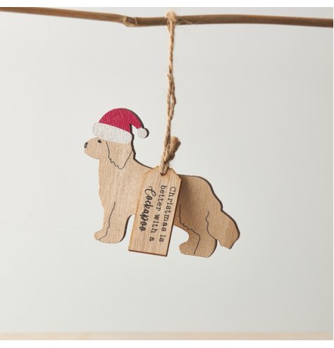 A Cockapoo shaped hanging decoration with "Christmas is better with a Cockapoo" tag and red Santa hat detail. 