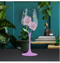 charming wine glass decorated with Allium flowers and bees. 