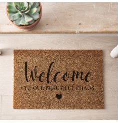 A simple yet stylish coir doormat with heart detail and "welcome to our beautiful chaos" message. 