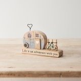 A rustic decoration made from wood in a caravan design