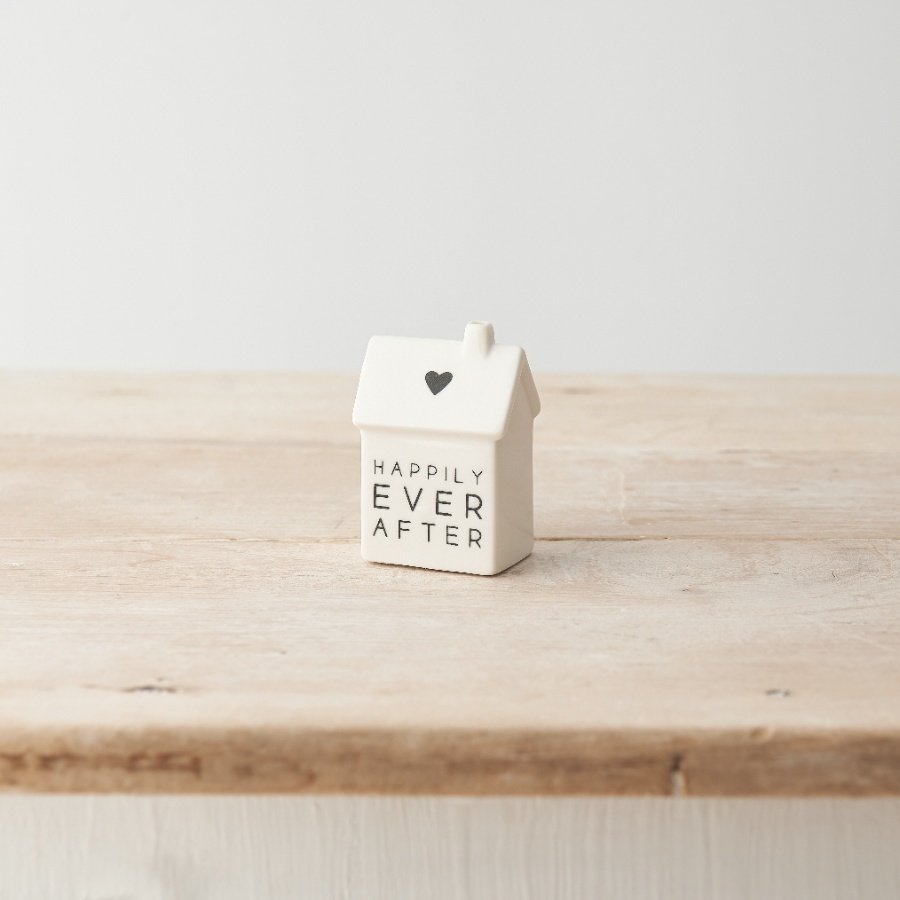 A stylish porcelain house decoration with simple heart detail and "happily ever after" message. 