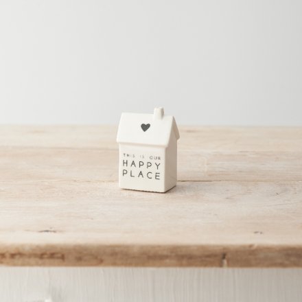 A super sweet porcelain house decoration with "this is our happy place" message and heart motif. 