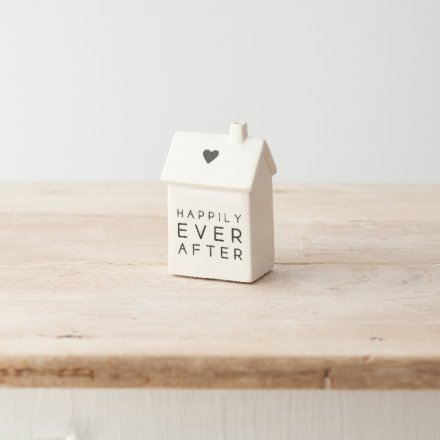 A simple yet stylish porcelain house decoration with "happily every after" message alongside a cute heart motif. 