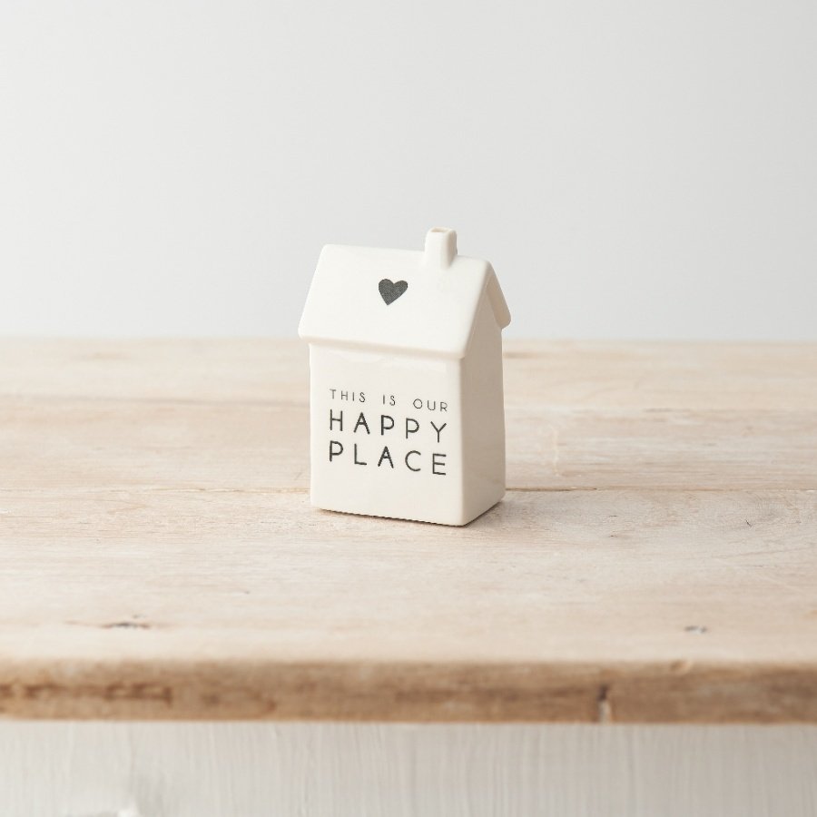 A charming porcelain house decoration with simple heart motif and "this is our happy place" message. 