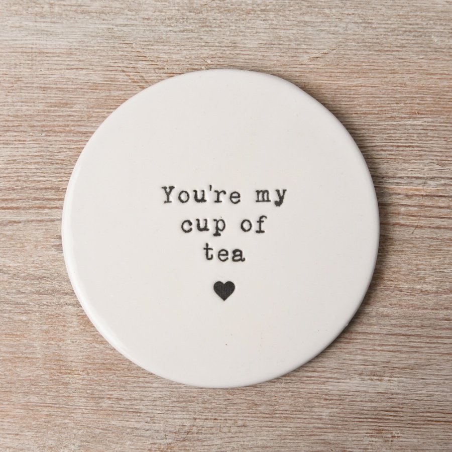 You're my cup of tea. A charming and unique porcelain coaster with a stamped tea slogan with heart detail. 