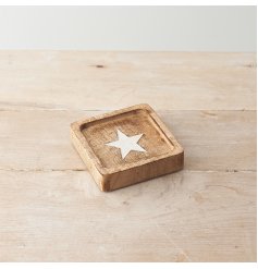 A square design decorative plate with whitewashed star design detail. 