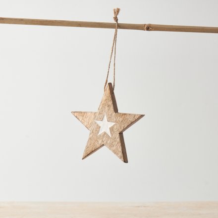 A star motif hanging decoration with twine hanger and small whitewashed star design detail. 