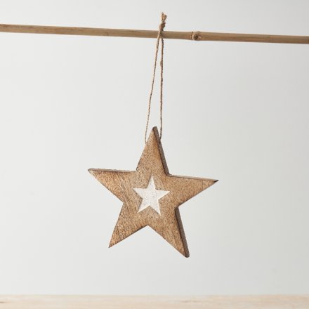A star motif hanging decoration with twine hanger and small whitewashed star design detail. 