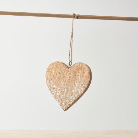 A sweet heart hanging decoration with delicate etched floral design and twine hanger.
