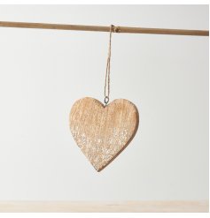 A sweet heart hanging decoration with delicate etched floral design and twine hanger.