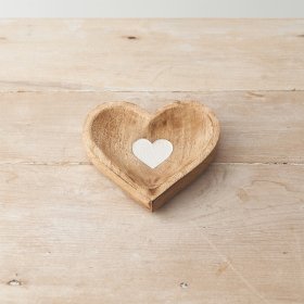 A stylish wooden heart shaped tray with a white washed detail. 