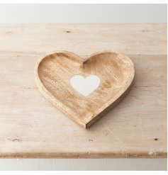 A charming heart shaped wooden dish with a white washed heart centre. 