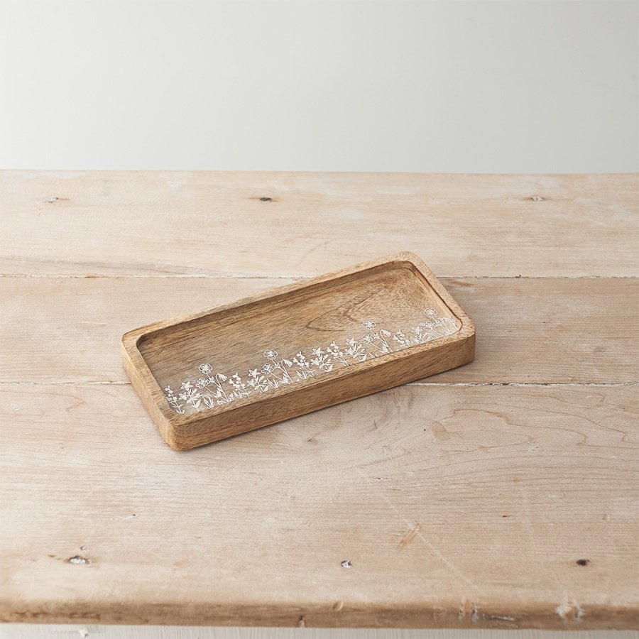 A unique tray made from natural mango wood. Beautifully carved with an etched wild flower design. 