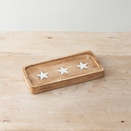 A chunky wooden tray made from natural mango wood. Decorated with 3 etched stars, each with a white washed finish. 