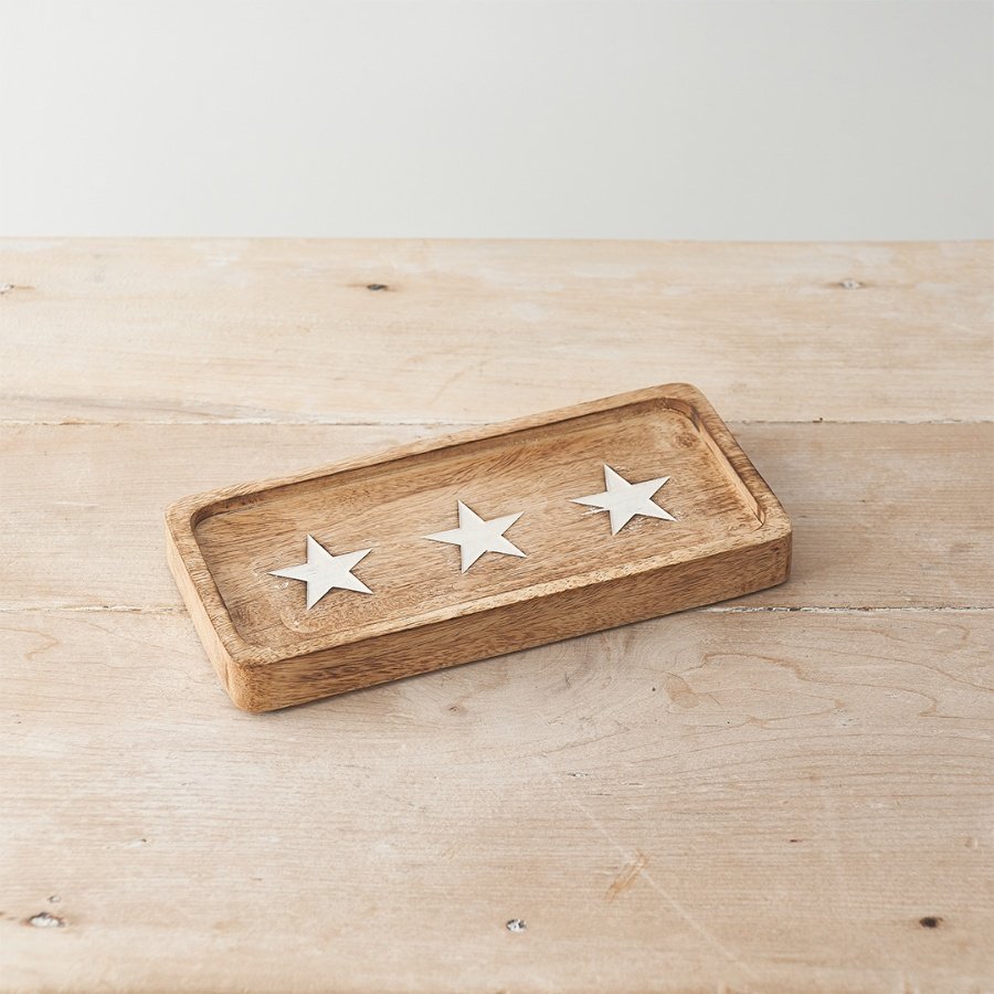 A stunning natural tray with a star design etched into the surface. 