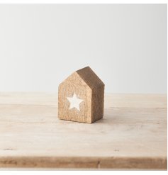 A cosy little wooden house with a white embossed star