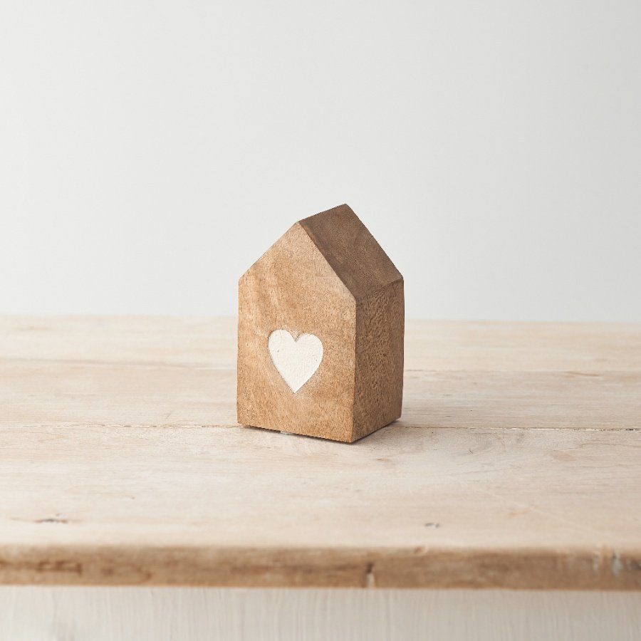 A charming contemporary house ornament which has been crafted from natural mango wood. 