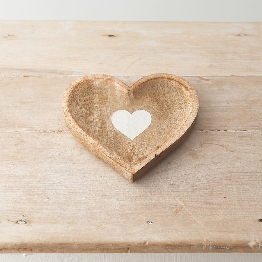 A unique heart shaped trinket dish that has been crafted from natural mango wood.