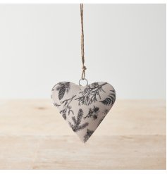 A chic metal heart decoration with a rustic winter foliage design in black and white 