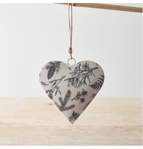 A stylish double sided metal heart decoration with a winter foliage decal and jute string hanger. 