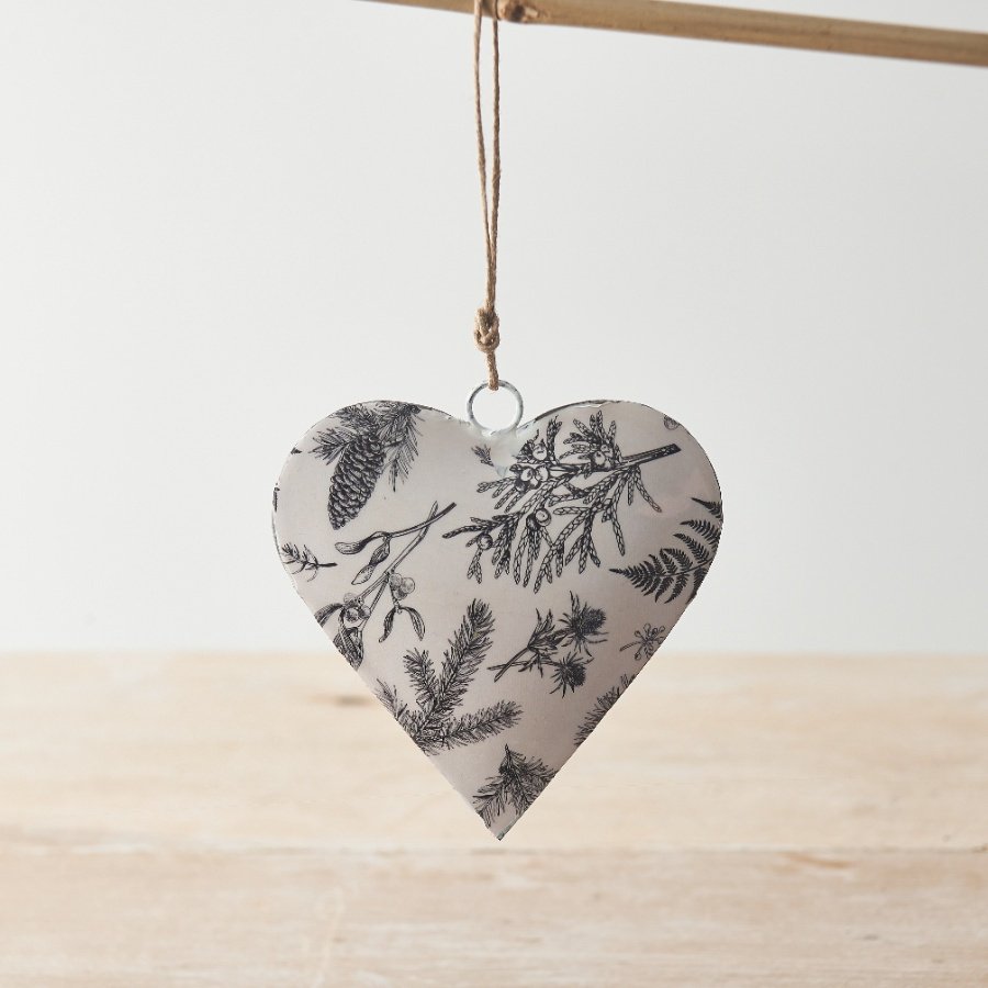 Adorn the home with this stylish monochrome hanging heart decoration with a seasonal winter foliage design. 