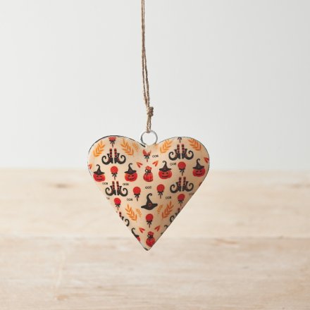 A metal heart shaped decoration with a jute string hanger. Adorned with a fun halloween themed decal