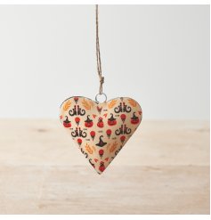 A metal heart shaped decoration with a jute string hanger. Adorned with a fun halloween themed decal