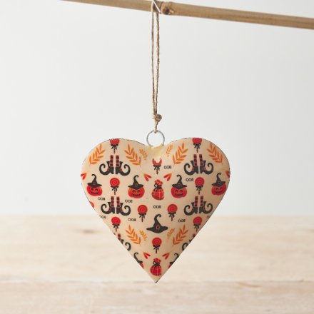 A stylish and unique metal heart decoration featuring black and orange halloween images. 