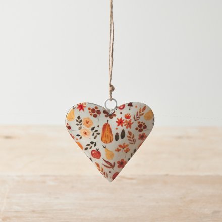 A chic metal hanging heart with a pretty pumpkin patch design, including autumnal leaves and flowers. 