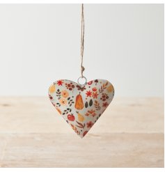 A chic metal hanging heart with a pretty pumpkin patch design, including autumnal leaves and flowers. 