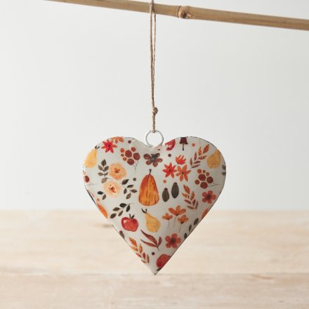 A chic metal heart decorated with a warm and cosy pumpkin patch design in rich autumnal colours. 