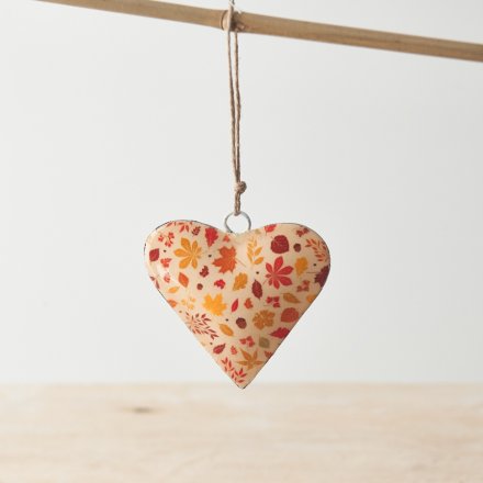 A colourful seasonal heart shaped decoration with a rustic jute string hanger. 